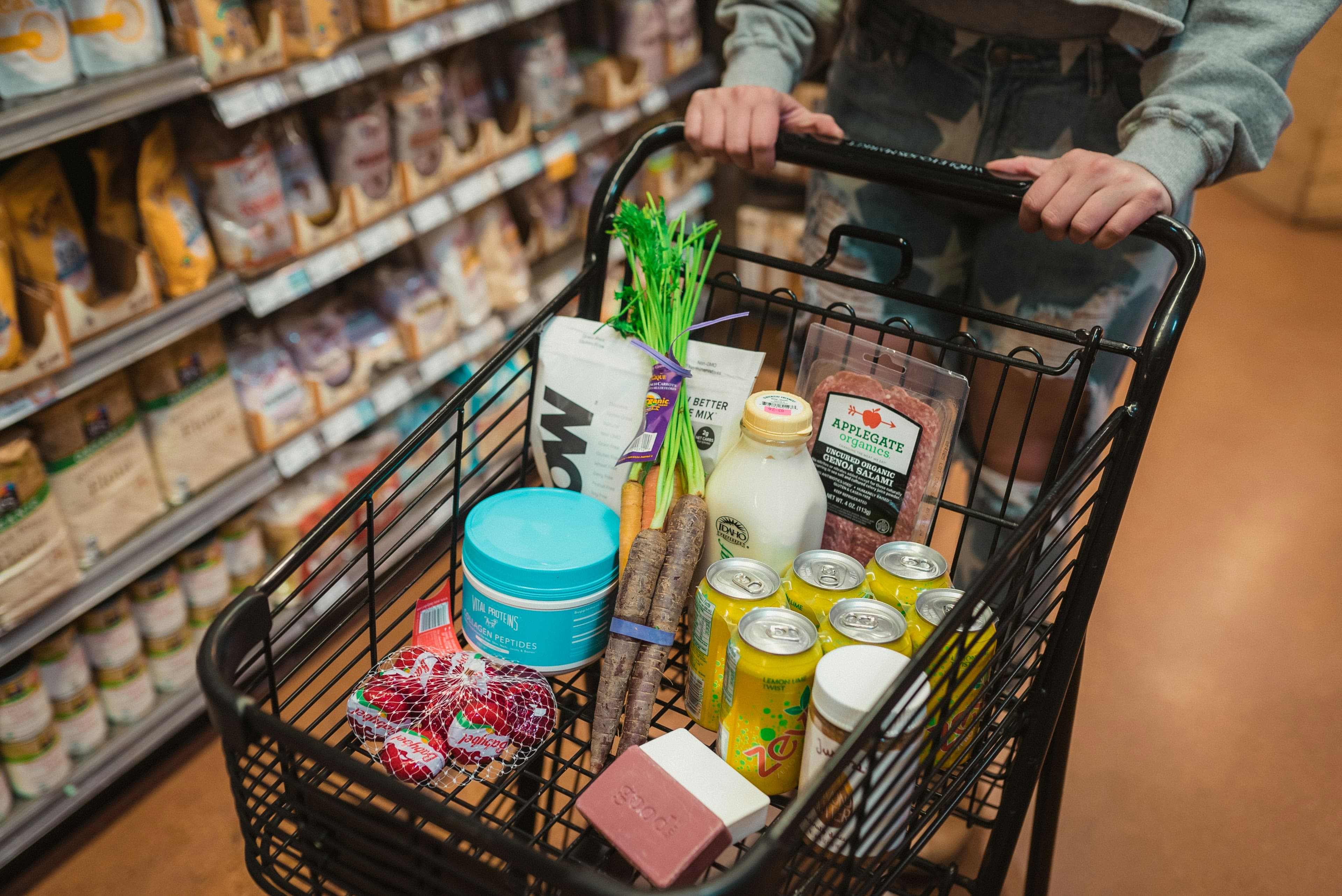 Shopping cart filled with grocery essentials
